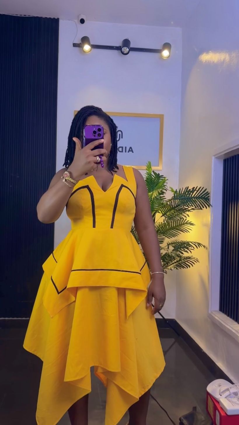 Yellow asymmetric dress mirror shot in the studio