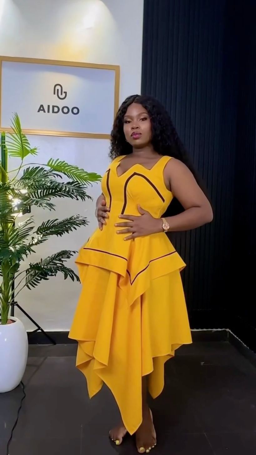 Sunflower-yellow asymmetric peplum dress with black piping
