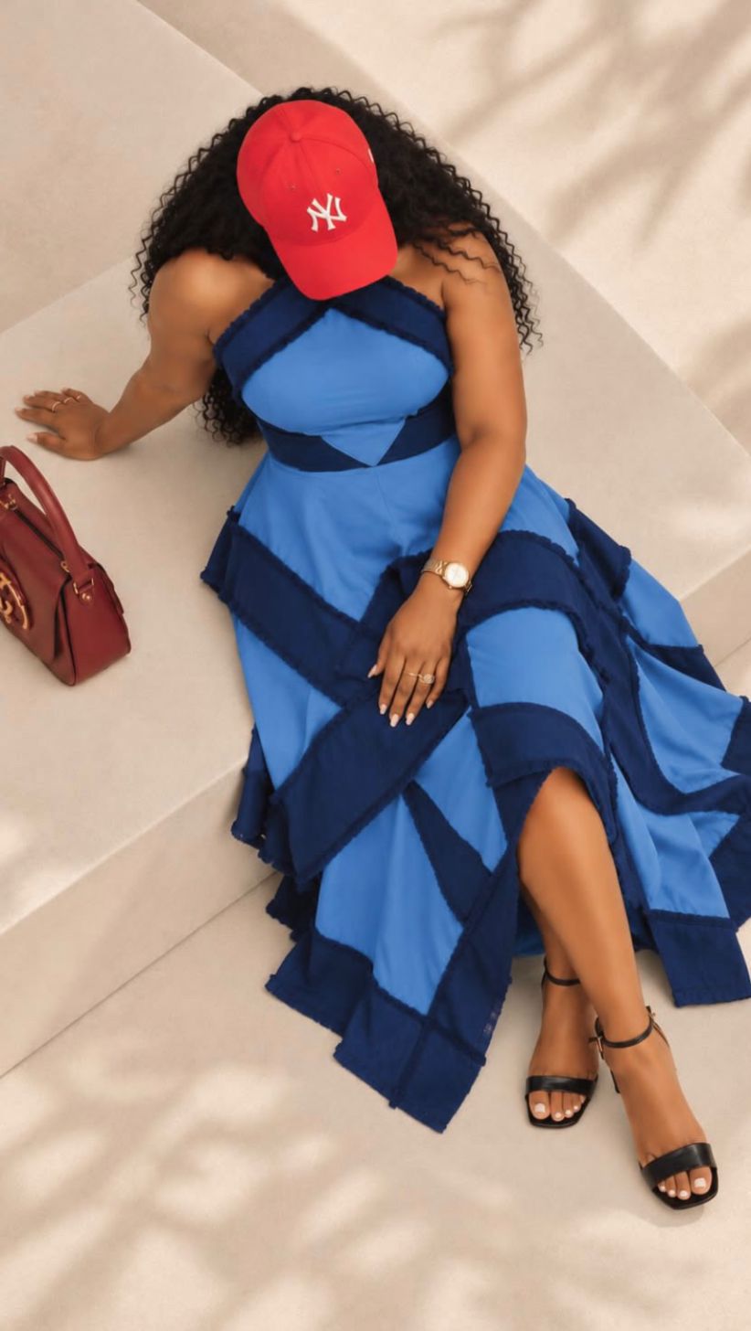 Patchwork denim dress styled seated on stone steps